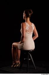 Sitting reference of whole body white dress white heels Little Caprice